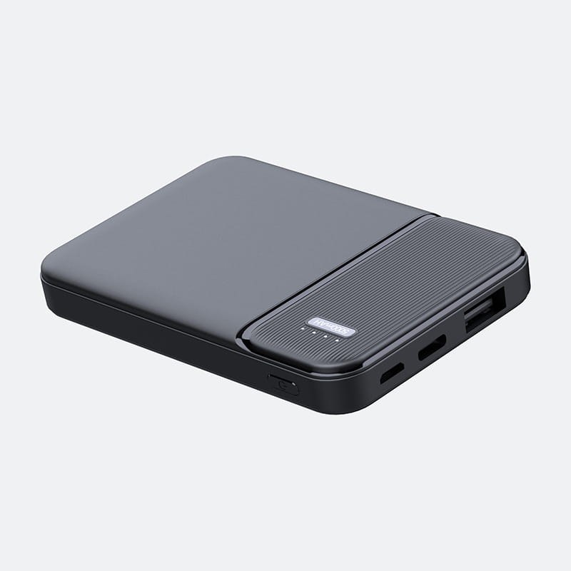 Black rectangular 5000mah portable power bank mini charger with a matte finish and textured panel on the side.