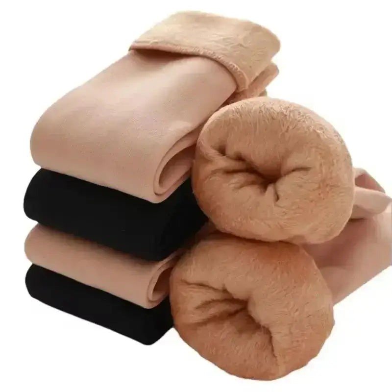 stack of beige and black winter thermal socks made from cashmere wool with plush fleece lining and soft fuzzy texture, neatly folded.