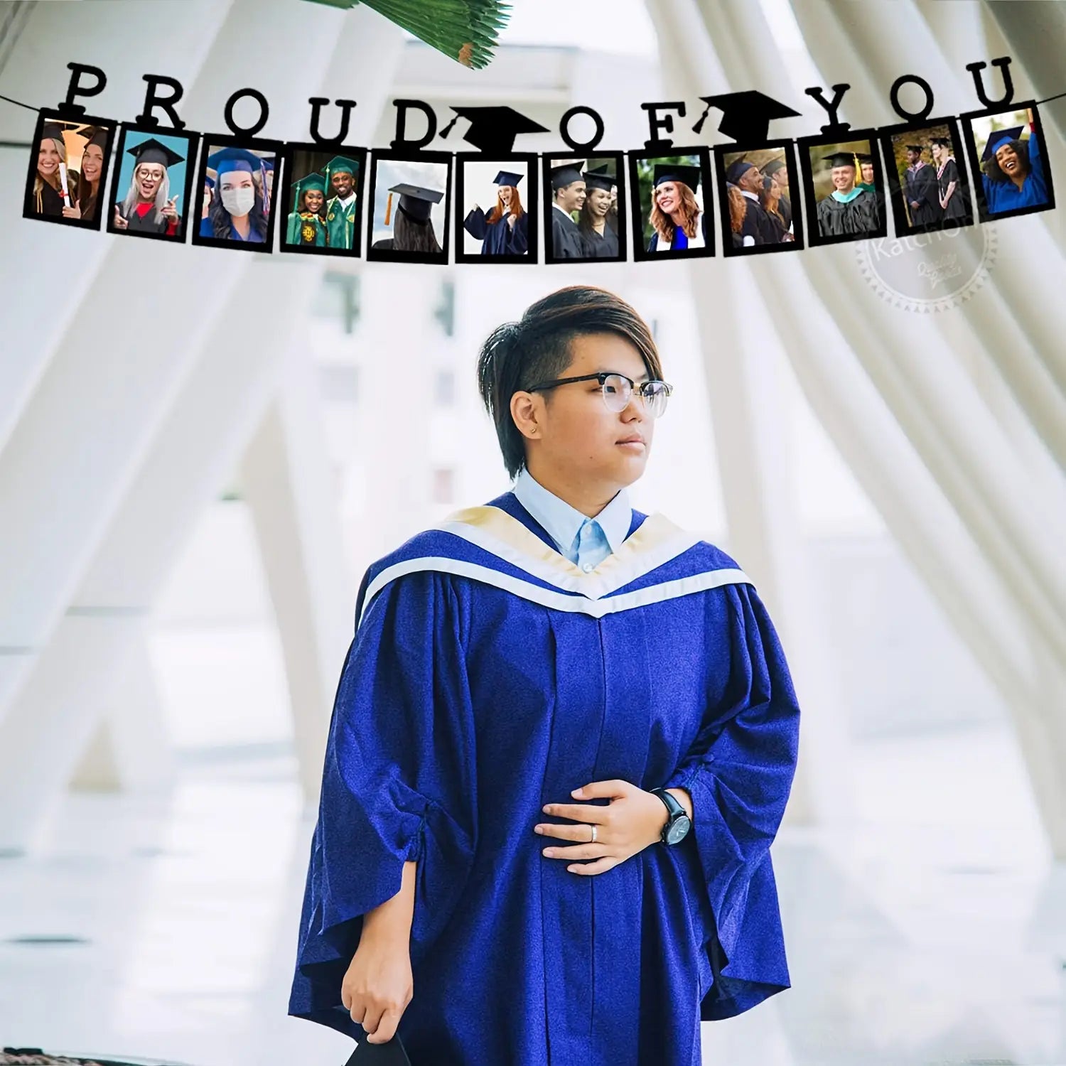 Black 2025 graduation photo banner featuring a blue graduation gown with white trim and a light blue shirt underneath.