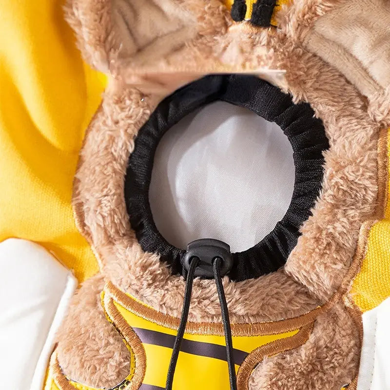 fluffy tan and yellow bee-themed hooded carrier bag made of canvas with a black drawstring closure designed for small dogs and cats with mouth length consideration