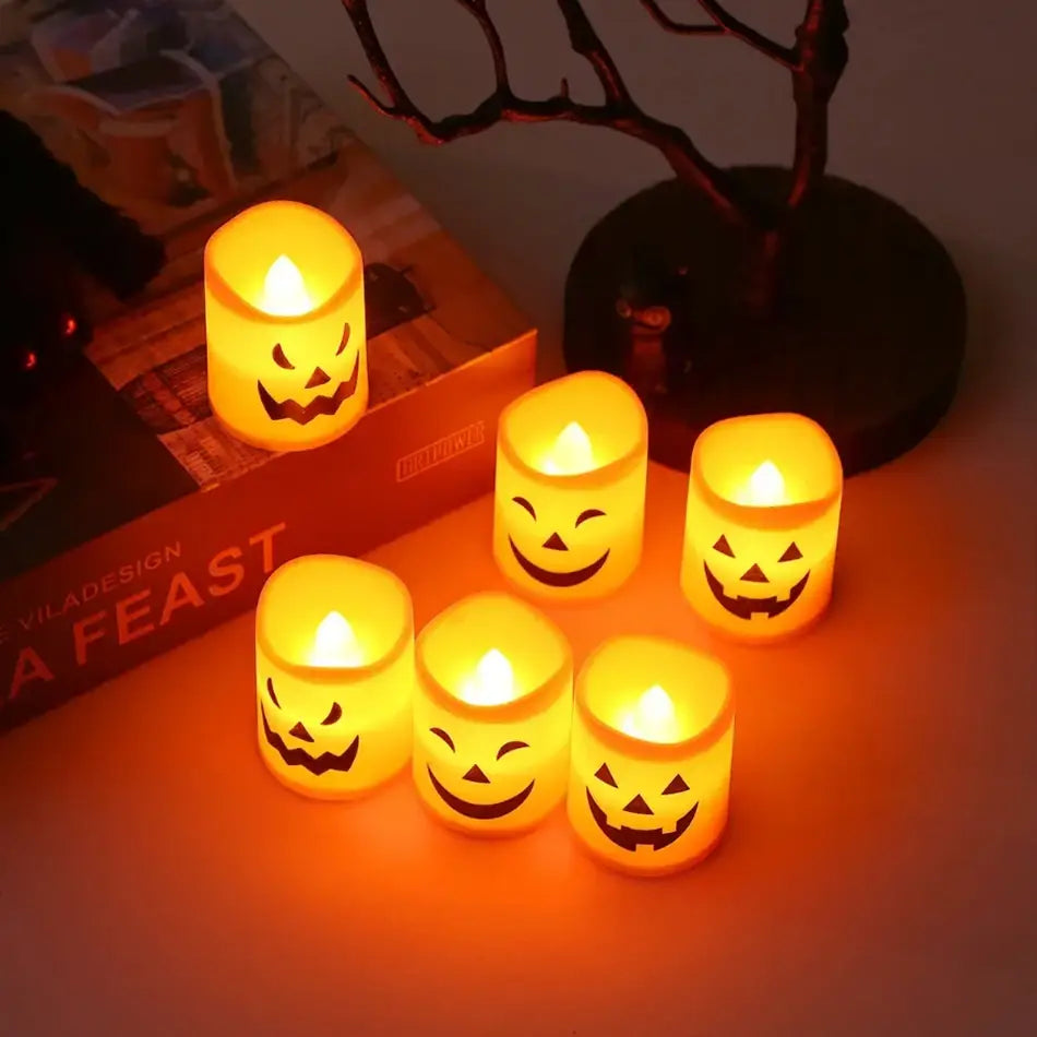 led halloween pumpkin lights 6-pack featuring six glowing orange led candles each with a distinct black jack-o-lantern face design.