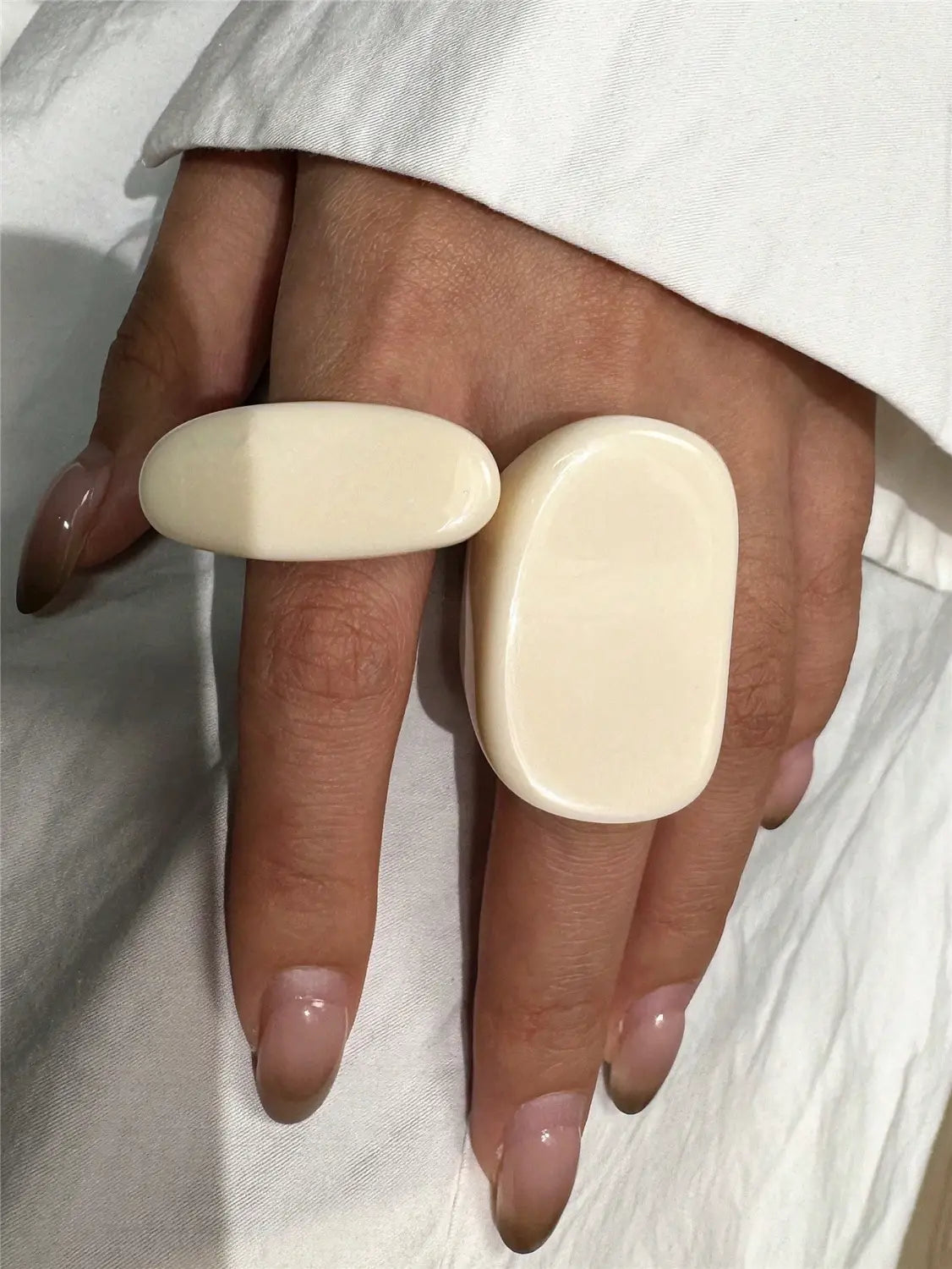 cream-colored chunky resin cocktail rings 4-piece set with smooth surfaces and modern minimalist design