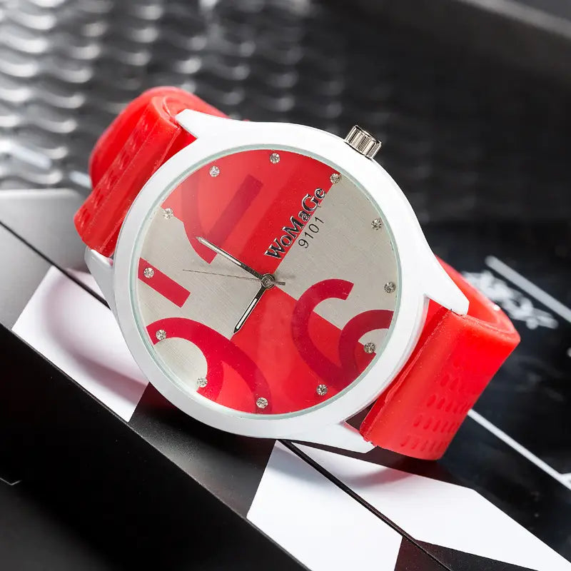 Red and white Womage silicone quartz women sports watch womace 9101 with bold red strap silver-toned case and crystal accents on the dial