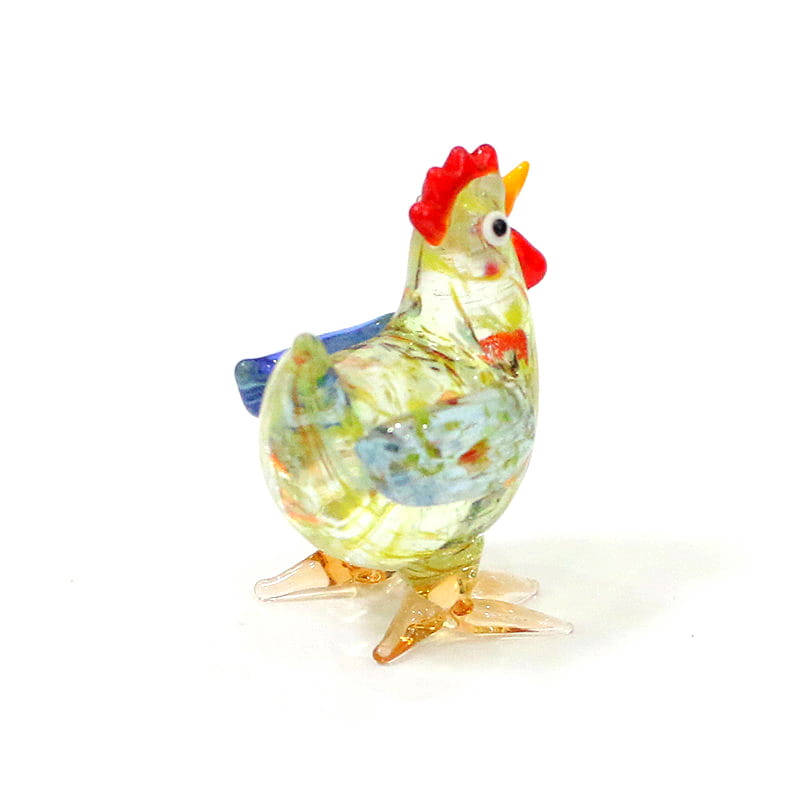 a translucent multicolored glass rooster miniature figurine with a red comb and wattle blue wing accents and amber feet used as an easter ornament