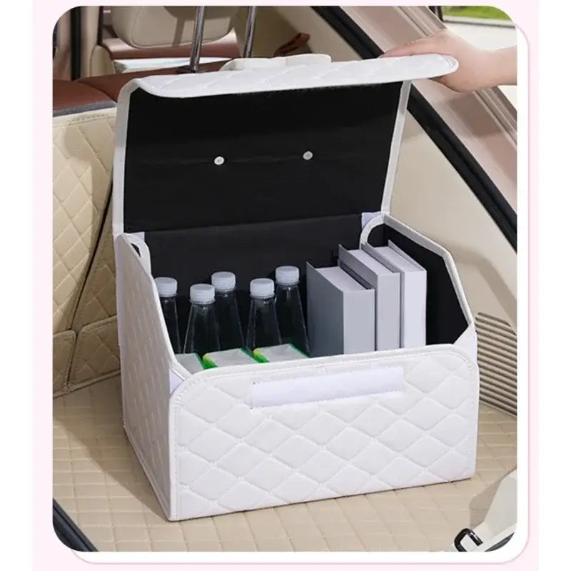 white quilted car trunk organizer with black interior and two silver buttons on the lid displayed in a pink quilted car trunk organizer with bow product.