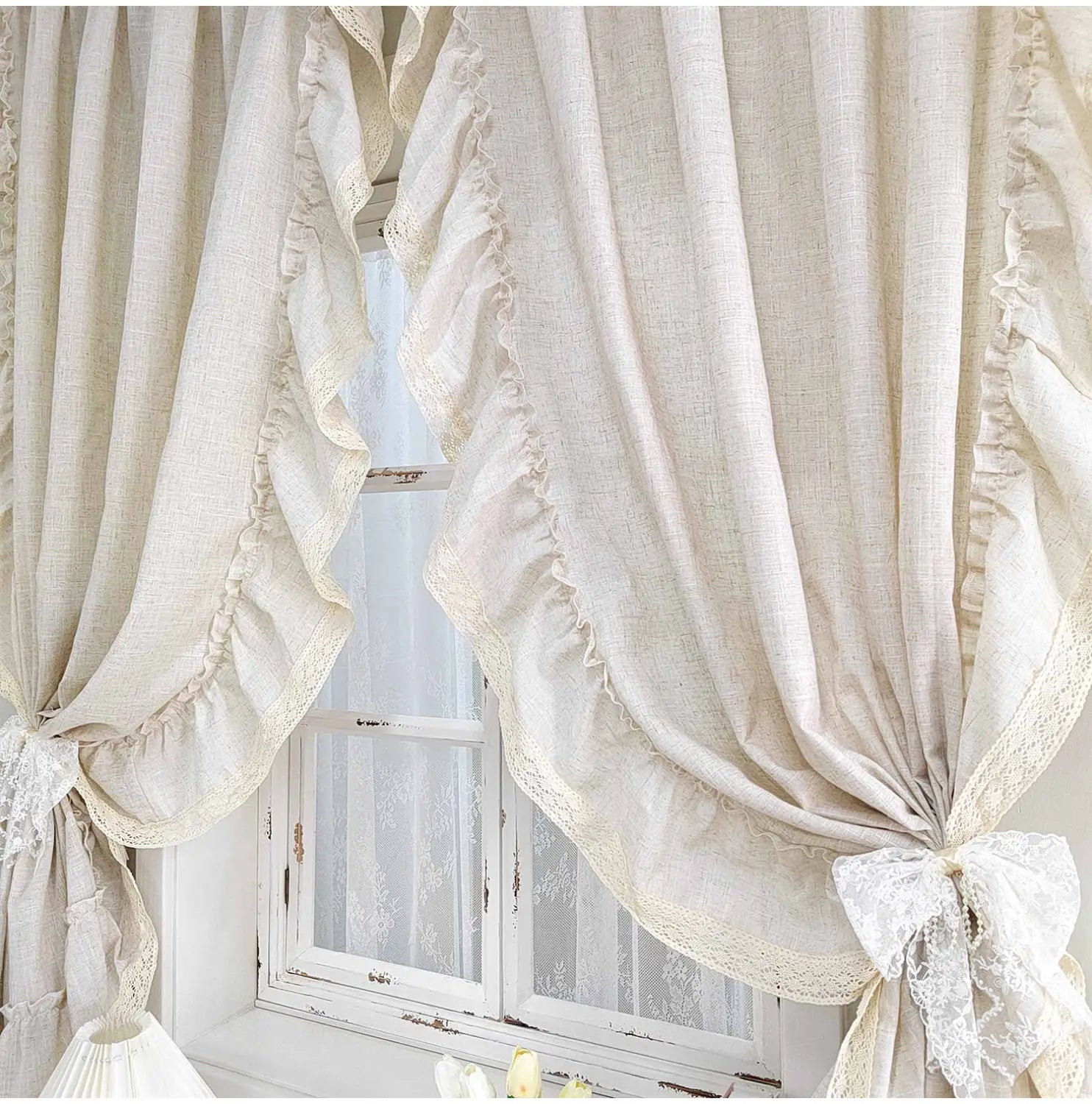 Beige linen ruffled linen curtains with delicate lace trim and gathered ruffles tied back with matching lace bows for living room use available in two pieces and accept customization.