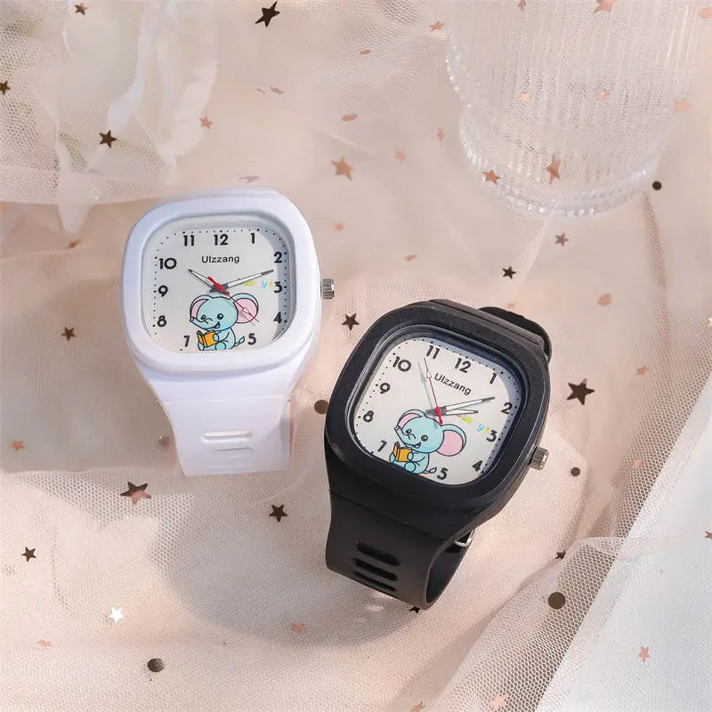 kids luminous cartoon elephant digital watch in white and black ulzzang brand square-faced design featuring cartoon elephant dials.