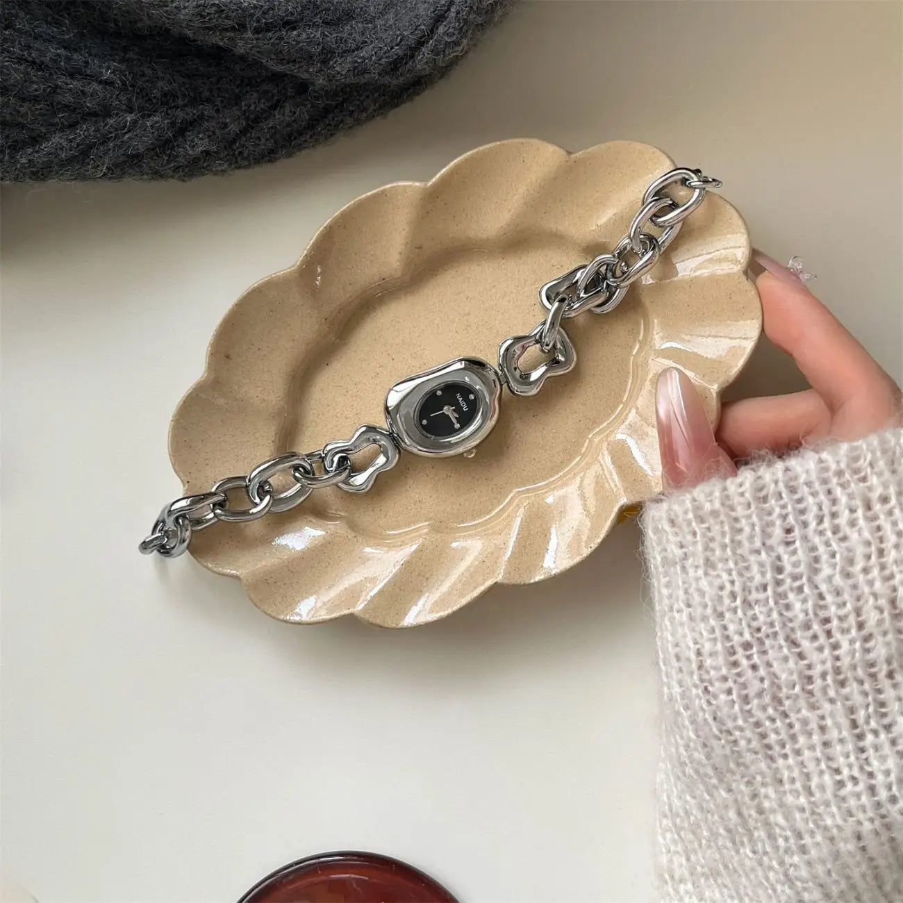 Gold chain link vintage wristwatch with a silver-toned polished metal chain-link band and a sleek minimalist face.