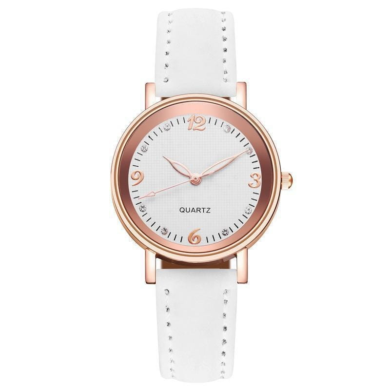 A delicate women quartz watch with a rose gold dial and white leather band featuring small crystals at hour markers and metallic accents.