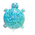 A translucent blue turtle shape squeeze toy filled with sparkling star confetti perfect as a sensory fidget toy