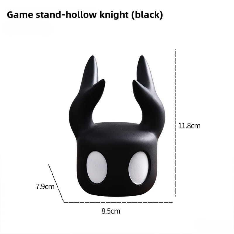 Black hollow knight game controller stand for PS5 with glossy finish and white oval eye details.