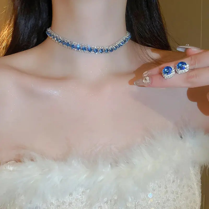 A sparkling blue and silver crystal necklace featuring a row of faceted stones from the pink AB wedding jewelry set.