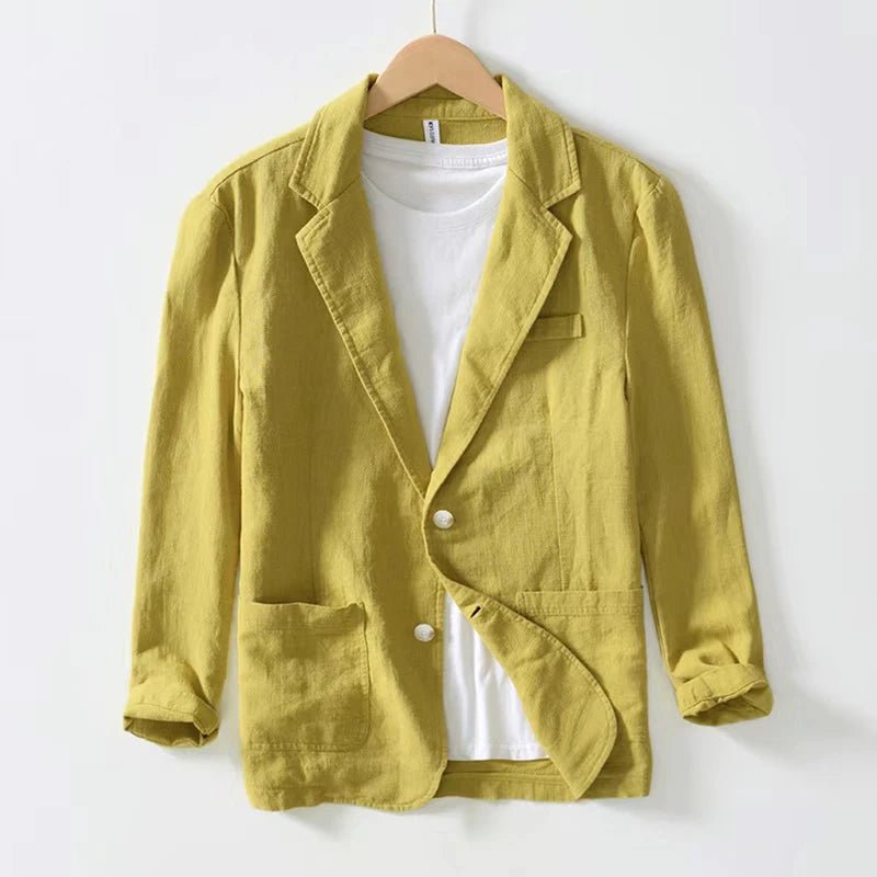 A mustard-yellow men cotton casual retro blazer jacket made of linen with a single-breasted design two front pockets and rolled-up sleeves.