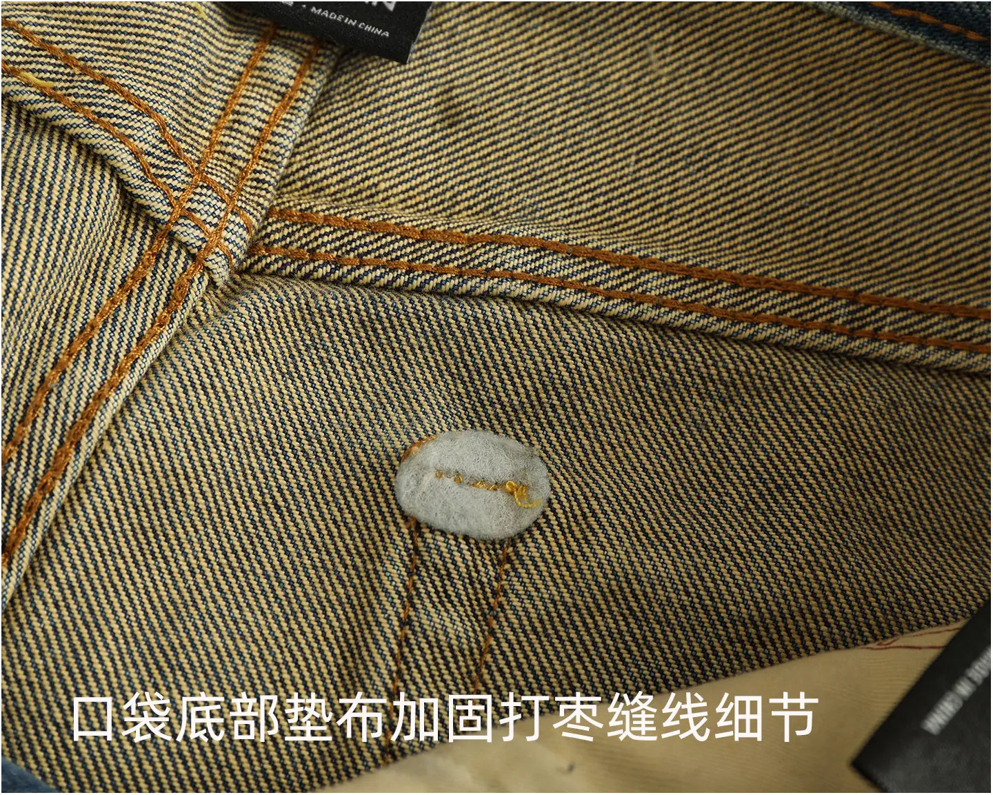 a beige denim pocket with brown stitching and a gray button on distressed patchwork denim jeans men