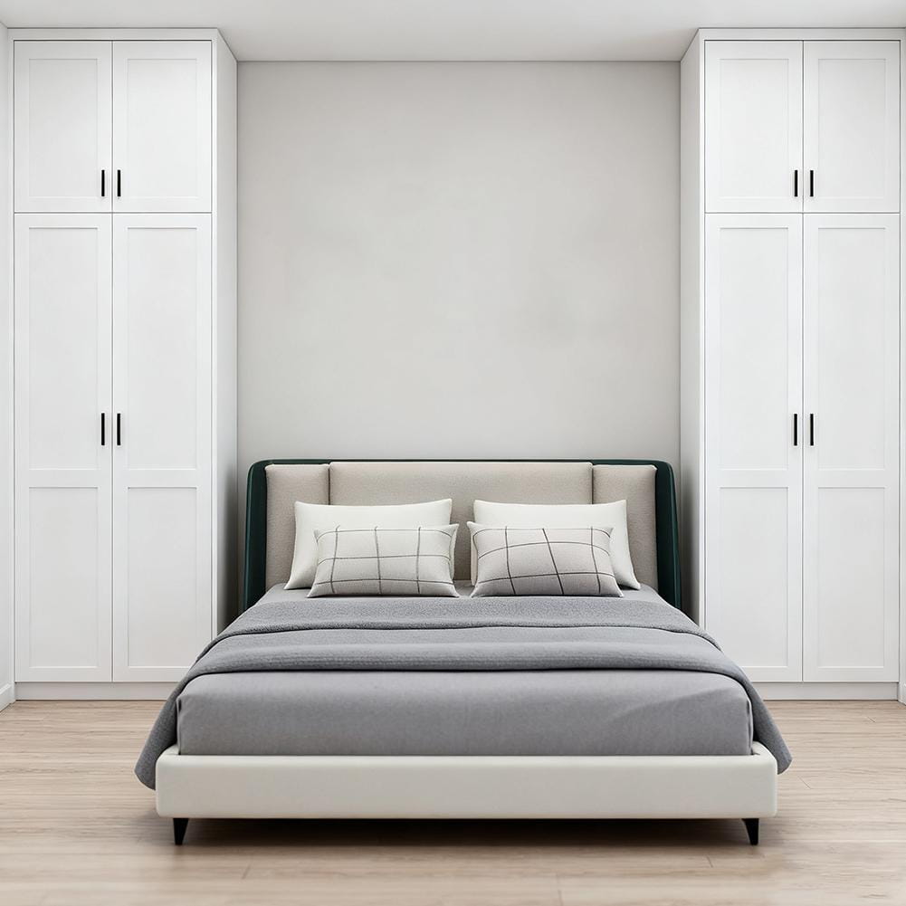 Miniature dollhouse double bed with cream style beige upholstered headboard and dark green trim dressed in gray bedding.