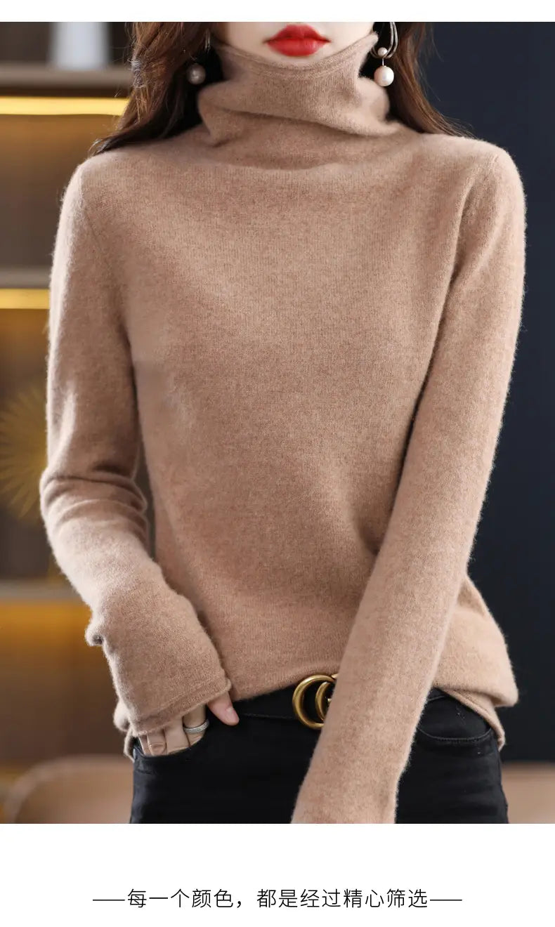 A soft beige merino wool turtleneck sweater for women featuring a cozy knit texture and long sleeves.