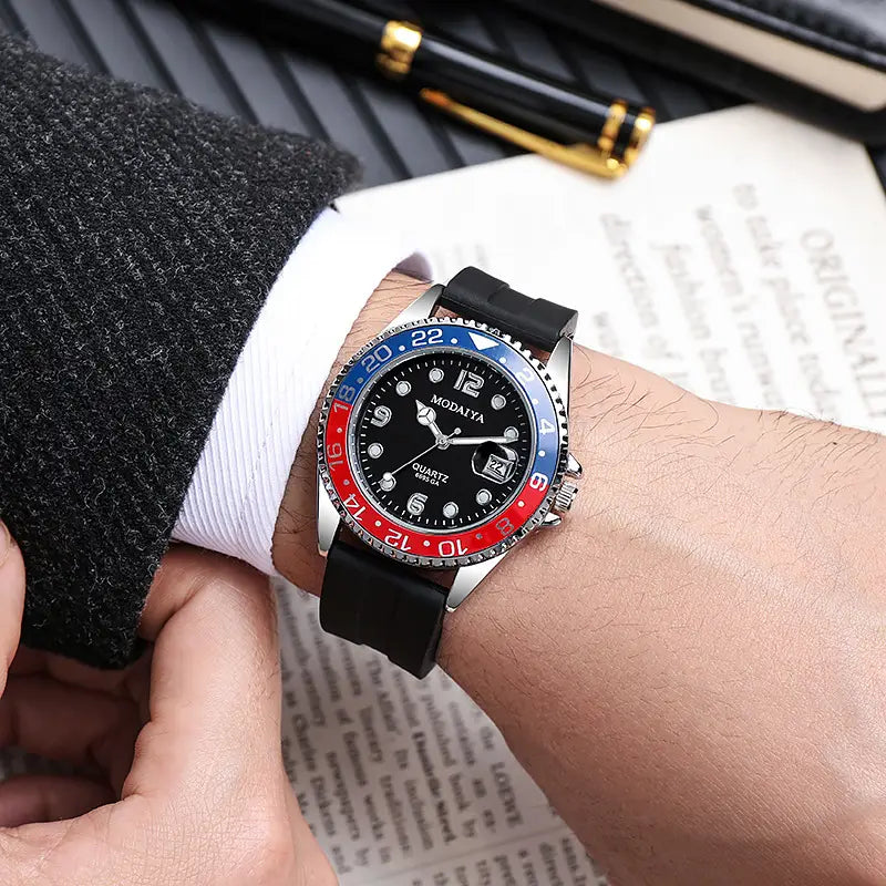 Quartz sport watch with black dial rubber strap featuring a silver case and two-tone red and blue bezel with the brand name modaiya on the face.