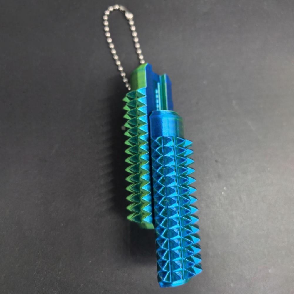 Rodillo giratorio para fidget con pinchos metálicos azul y verde con cadena de bolas, diseñado como juguete antiestrés tipo fidget 5 en 1