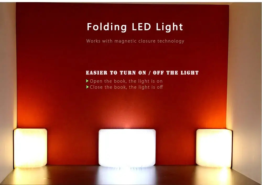 Luz LED plegable blanca rectangular con diseño de cierre magnético, mostrada desde un ángulo frontal.