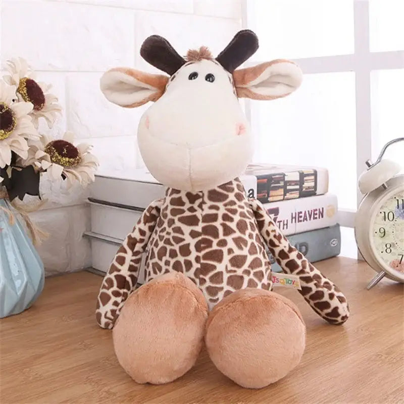 cute brown and cream giraffe plush toy with soft fabric black ears and eyes as part of the lion elephant tiger plush stuffed animal toy collection