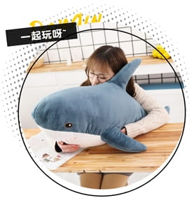 A plush blue and white shark stuffed animal pillow with a soft and cuddly texture.