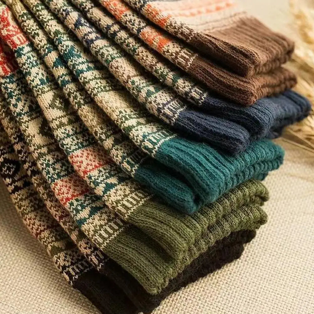 A stack of men retro cotton crew socks in mid-high tube length featuring cozy knitted fabric in teal with intricate geometric patterns and ribbed cuffs reflecting a fashion trend.