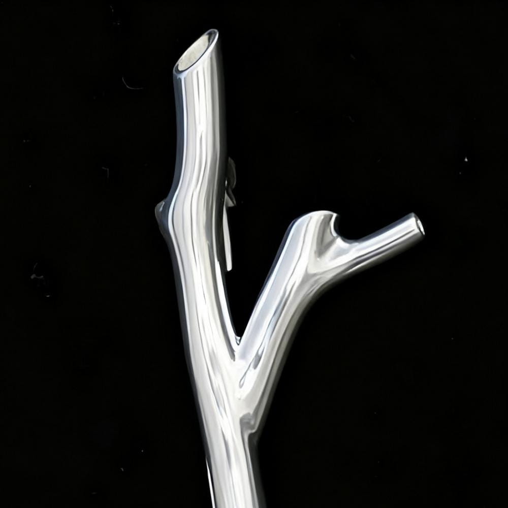 Silver tree branch brooch pin featuring a polished silver metallic finish with a branching design for fashion corsage use.