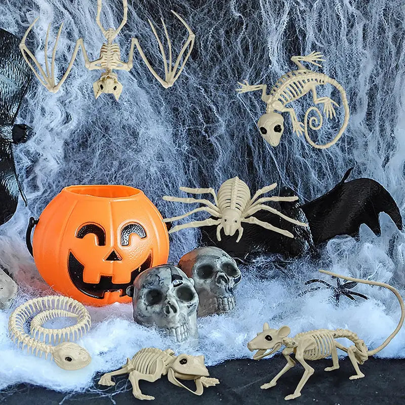 orange plastic pumpkin bucket with black carved face and handles from the halloween animal skeleton props set