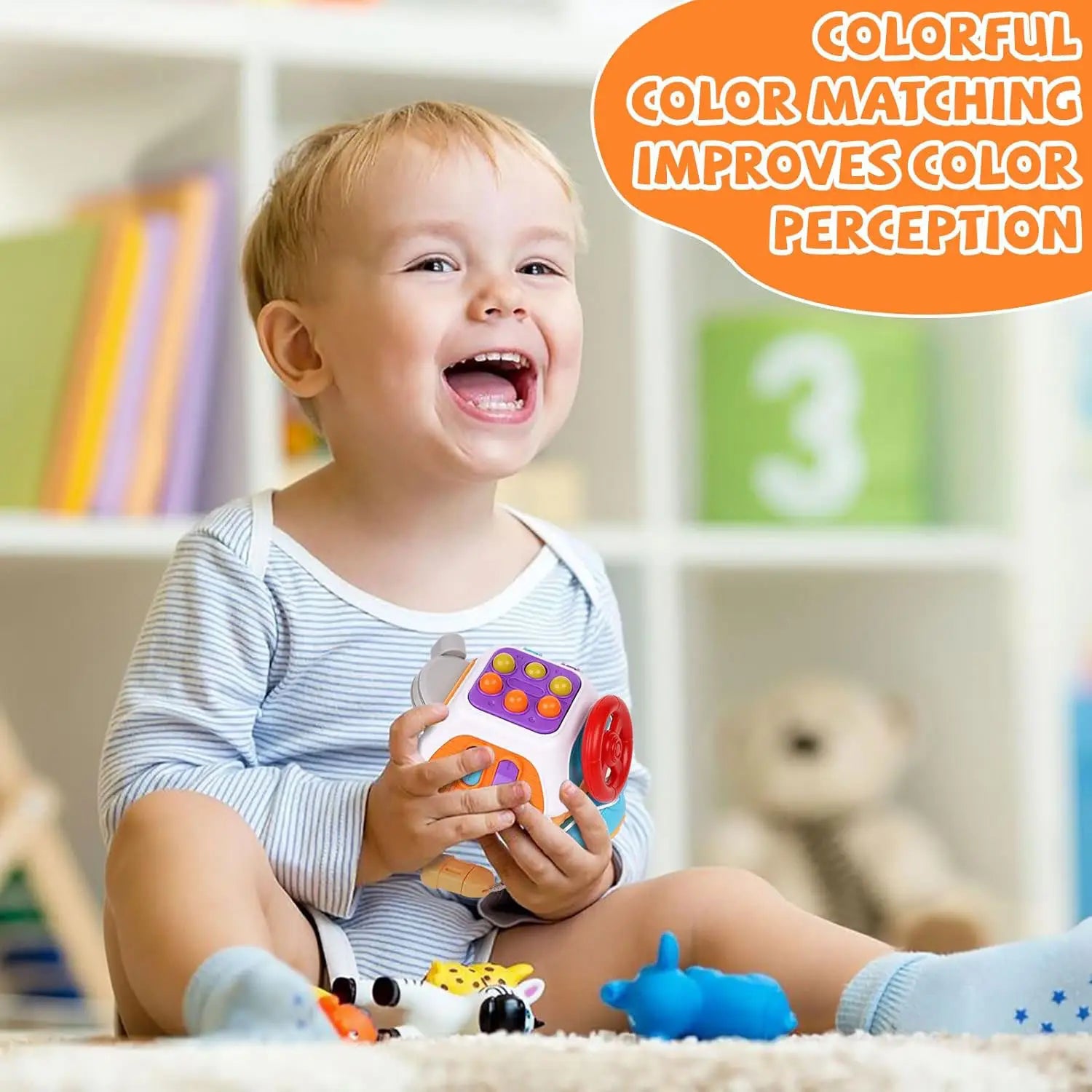 Jouet de voyage cube d’occupation Montessori en plastique, avec un cube souple et coloré d’association des couleurs, présentant des boutons orange, violet et rouge vifs.