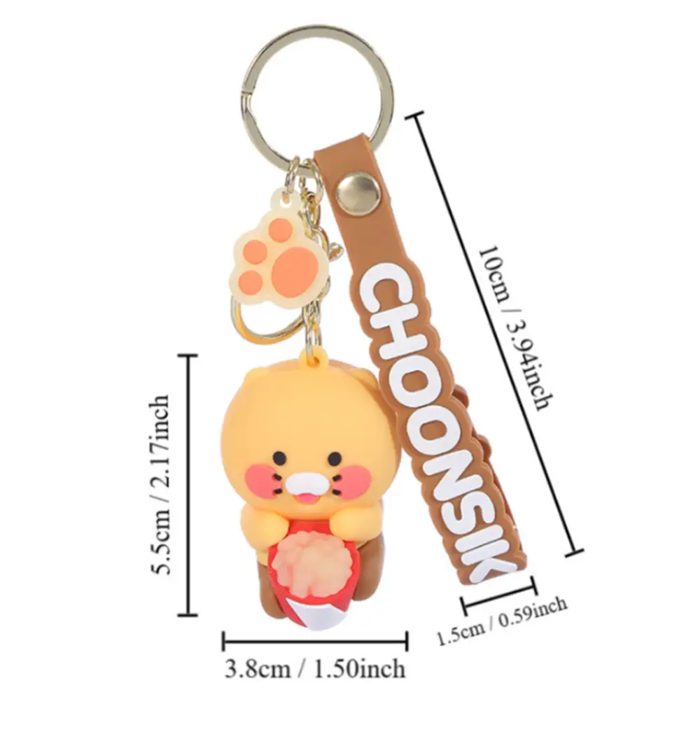 yellow plush choonsik silicone scooter keychain with pink cheeks and red heart attached to a brown leather strap featuring the brand name in white lettering, a popular korean viral gift.