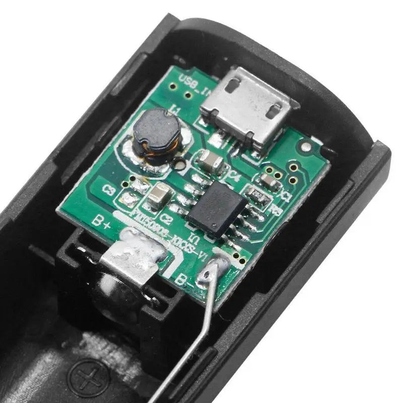Black plastic usb charging adapter with green circuit board and silver usb port for portable 18650 power bank case diy shell charger.