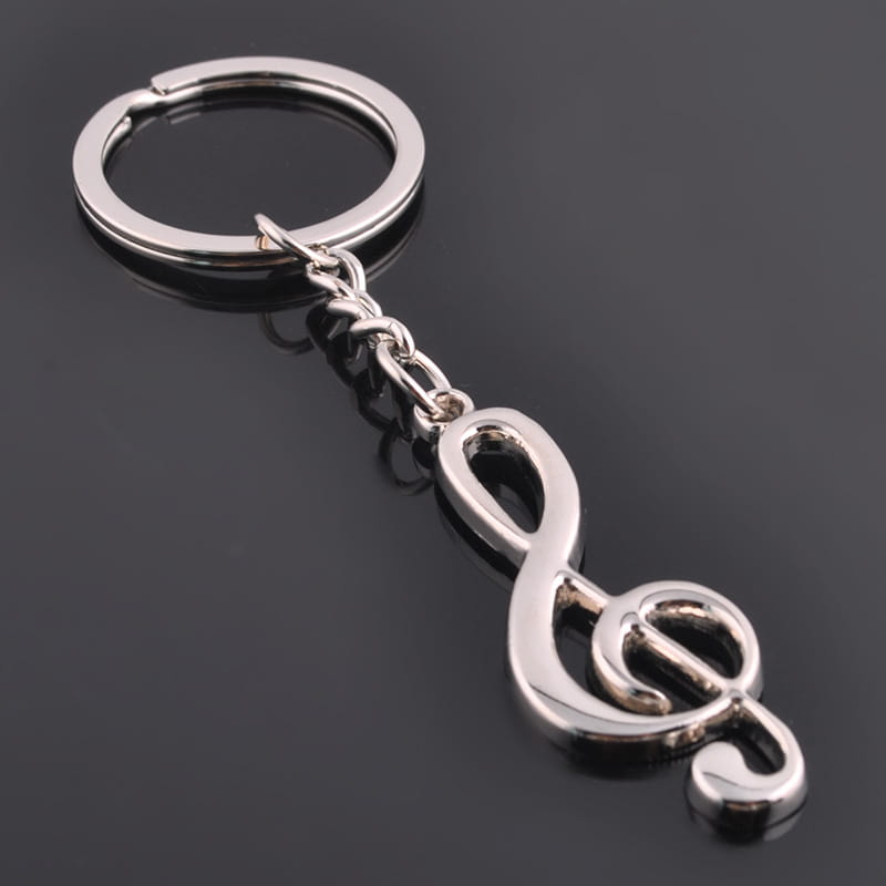 Silver-colored metal keychain featuring a polished treble clef charm for music note enthusiasts.