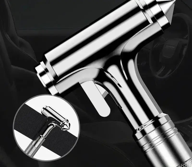 Shiny chrome-finished t-shaped car safety hammer and seat belt cutter rivet gun with textured grip and pointed tip.