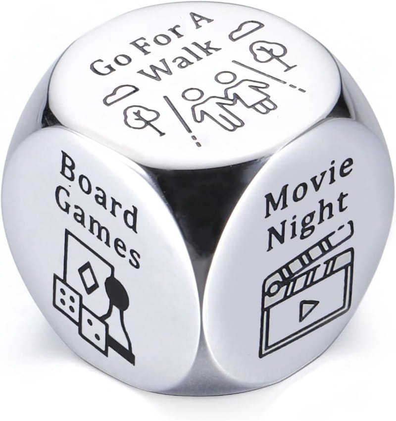 Shiny silver stainless steel six-sided food decision dice for couples date night with black engraved activity prompts such as go for a walk board games and movie night on each face.