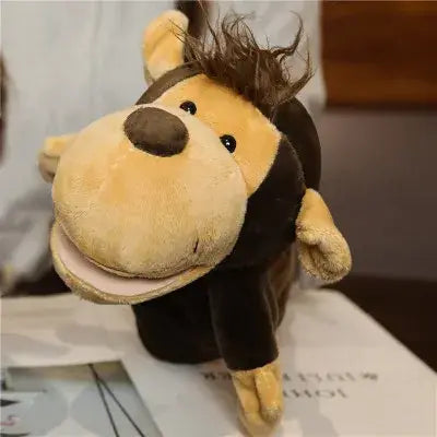 A plush monkey toy with a tan face black body brown nose and spiky dark hair featured in educational baby toys hand finger lion elephant bunny puppets.