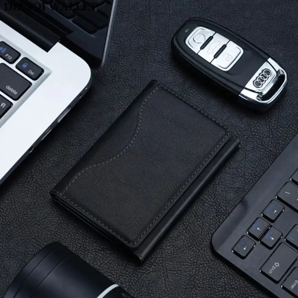 Black leather magnetic trifold card wallet with stitched edges and a subtle textured finish shown from the front angle.
