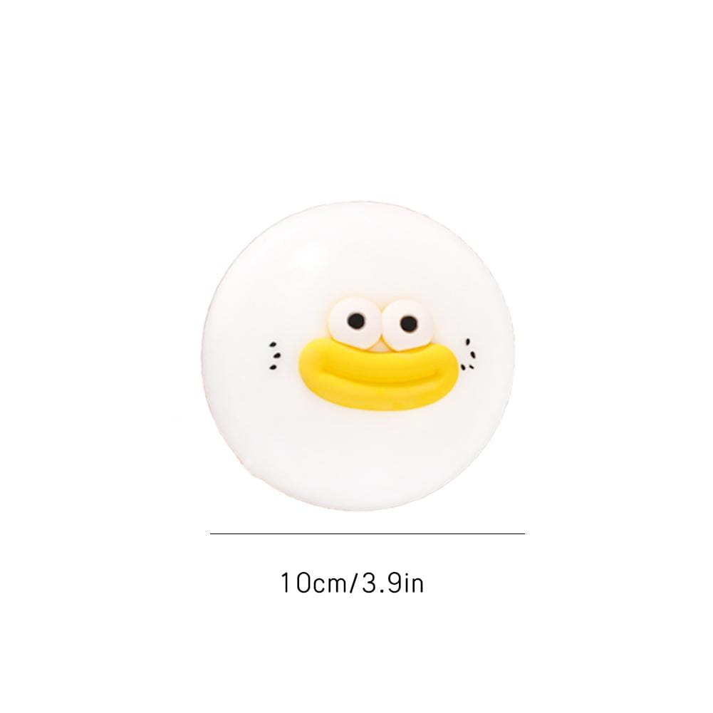 weißer runder Stressabbau-Spielzeug-Button mit einem niedlichen Entengesicht, schwarzen Augen, gelbem Schnabel und kleinen schwarzen Punktwangen, entworfen als langsam aufsteigendes Druck-Press-Spielzeug zur Stresslinderung.