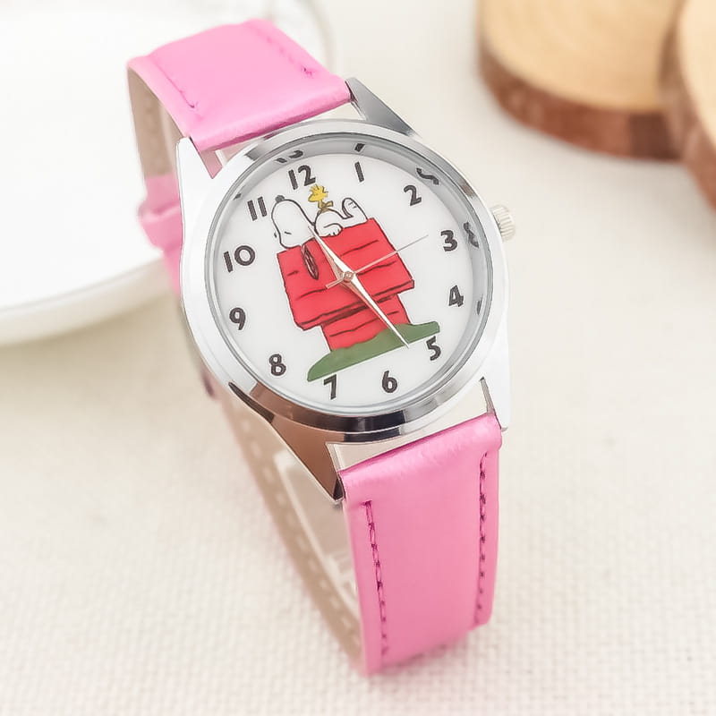 Pink leather strap Snoopy quartz watch with a white face featuring Snoopy in his red doghouse and black numerals.