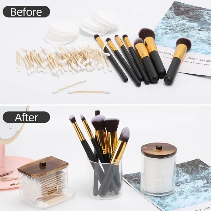 Set of makeup brushes with black handles and gold ferrules featuring soft bristles in various sizes displayed alongside an acrylic q-tip and cotton ball storage jar set.