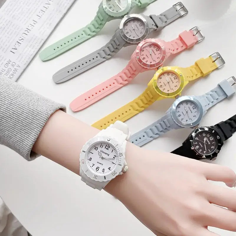 White kids silicone quartz watch with a minimalist dial and silver-tone bezel designed as a colorful jelly wristwatch.