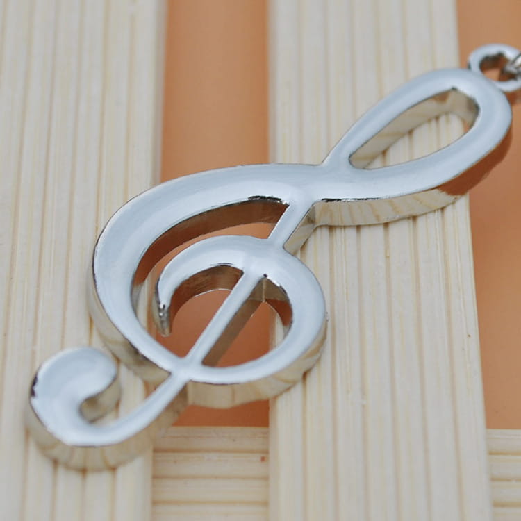 shiny silver treble clef pendant necklace charm made of silver metal for a treble clef music note keychain.