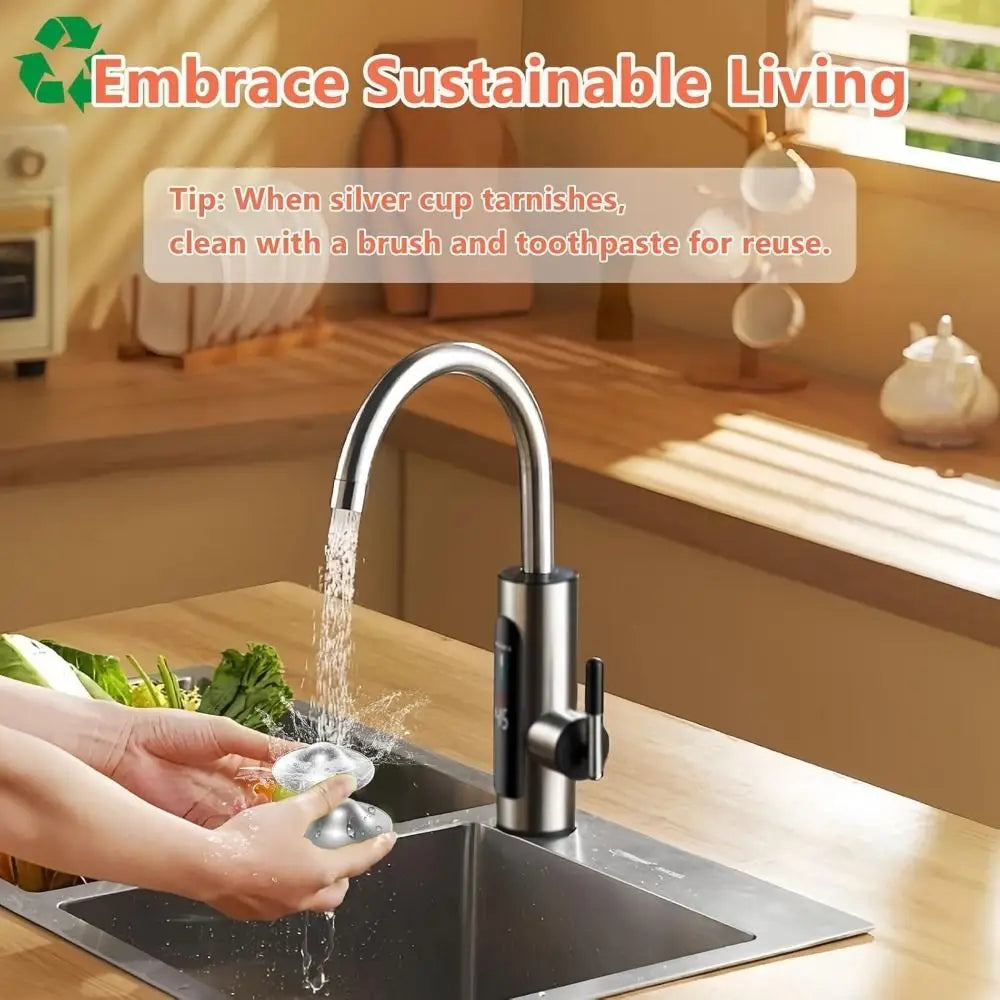 Modern stainless steel electric faucet with sleek curved spout and black control knob shown alongside silver nipple shields for breastfeeding to soothe soreness.