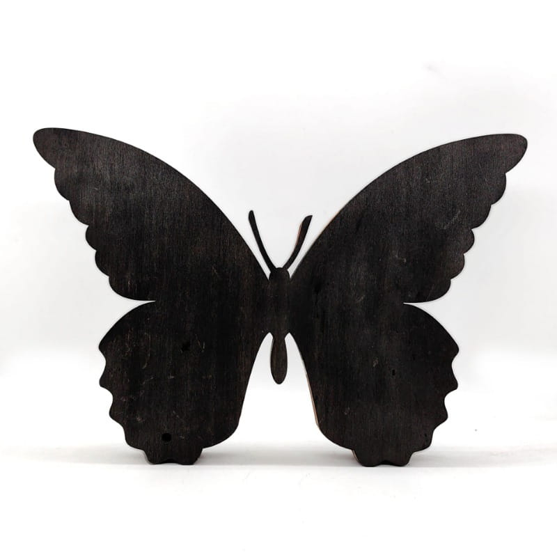 Black wooden butterfly led light tabletop decor with detailed wing edges and smooth matte finish.