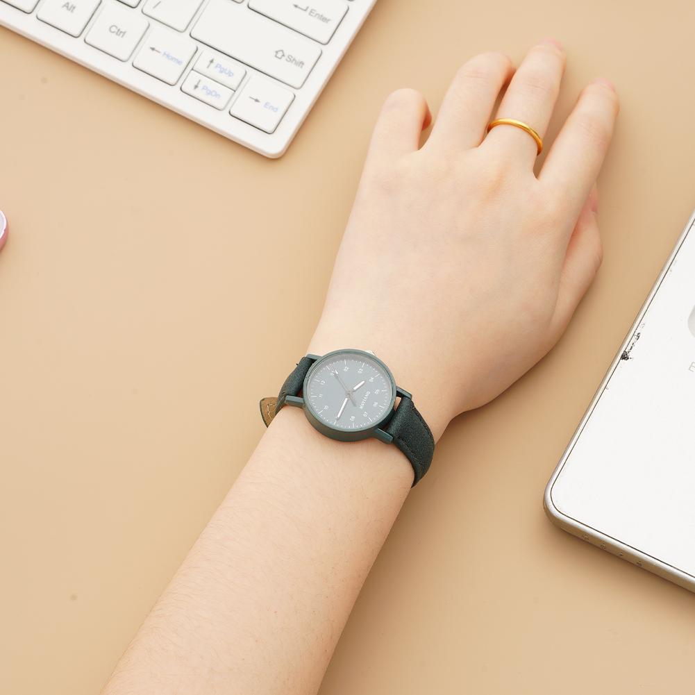 A sleek black leather-strapped women quartz watch with a minimalist gray dial and simple hour markers designed for waterproof wristwear.