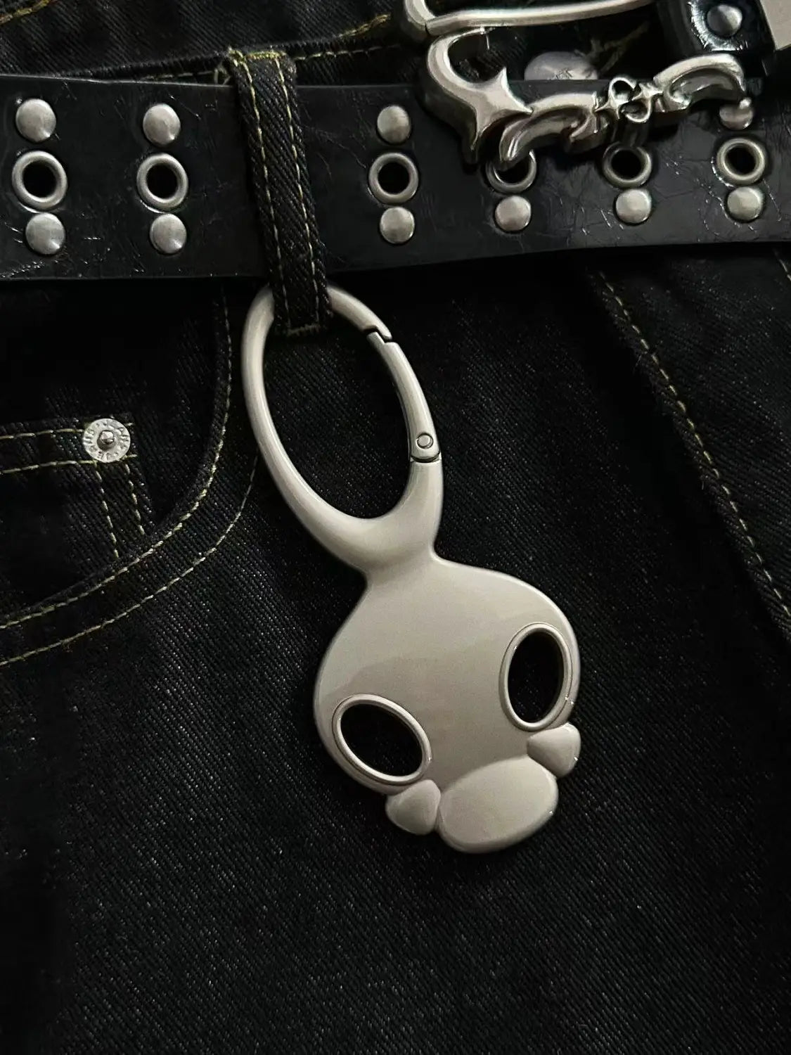 Silver skull metal car keychain bag charm with sleek minimalist design and polished metallic finish.