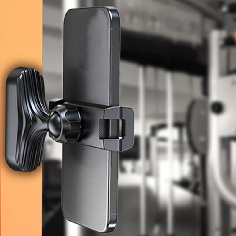 Black magnetic gym phone holder with textured grip and 360 adjustable clamp holding a smartphone