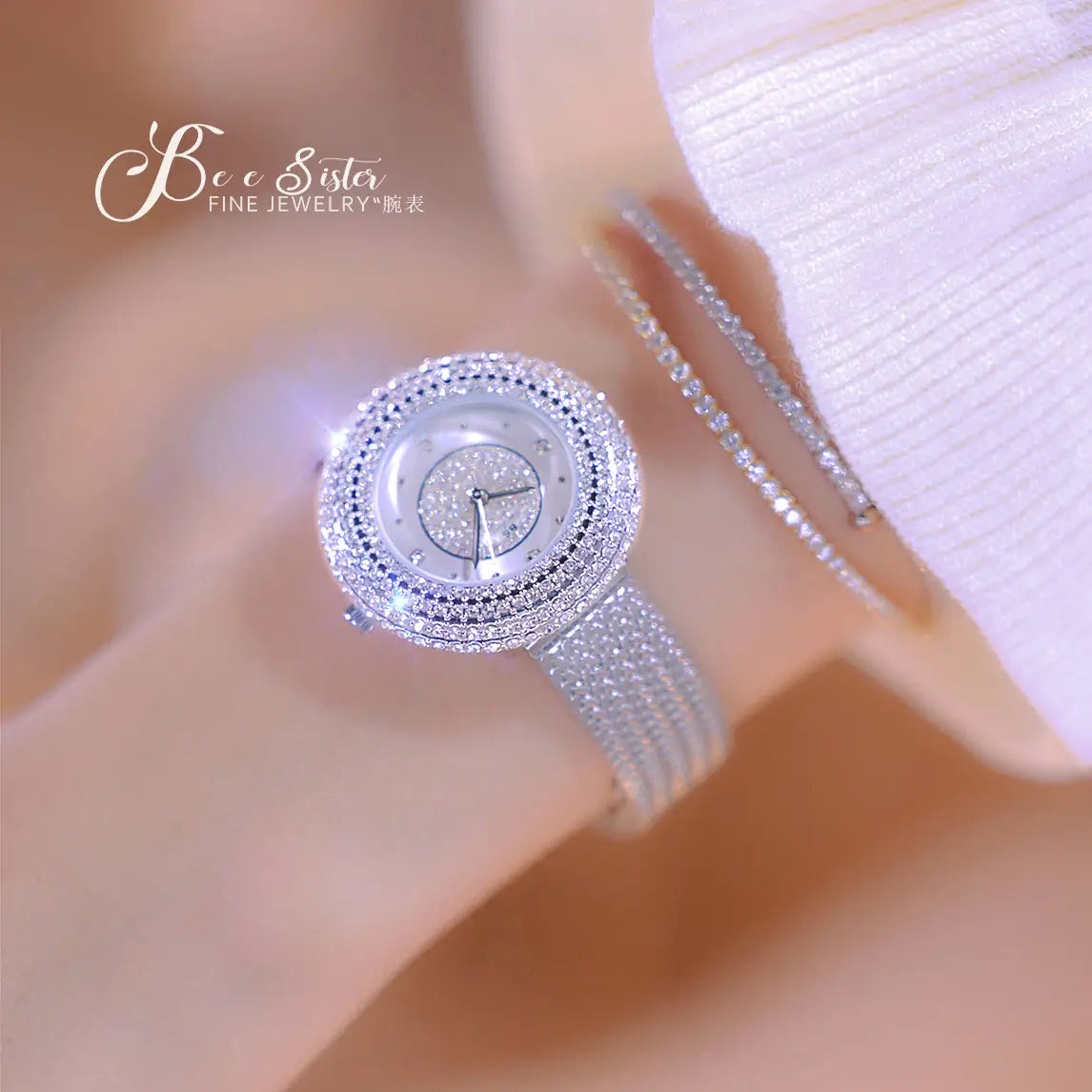 A sparkling silver diamond-encrusted gold diamond mesh women watch with a round face and mesh band worn on a wrist.