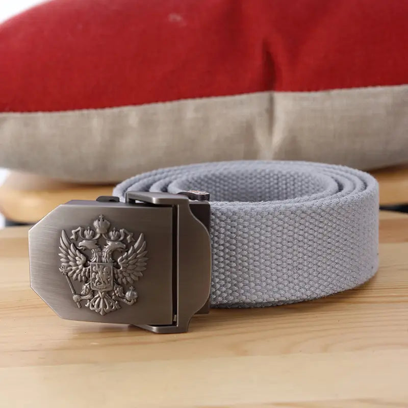 Ceinture tactique en toile grise à aigle russe pour hommes, avec une boucle argent métallisé présentant un emblème d’aigle bicéphale en relief.