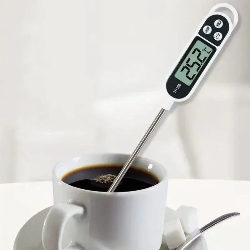 Weiße digitale Fleischthermometer-Sofortanzeige für Lebensmittel mit Edelstahlspitze, Anzeige von 25,2 Grad Celsius, mit Modusauswahltasten sowie Tasten zur Umrechnung der Temperatureinheit.