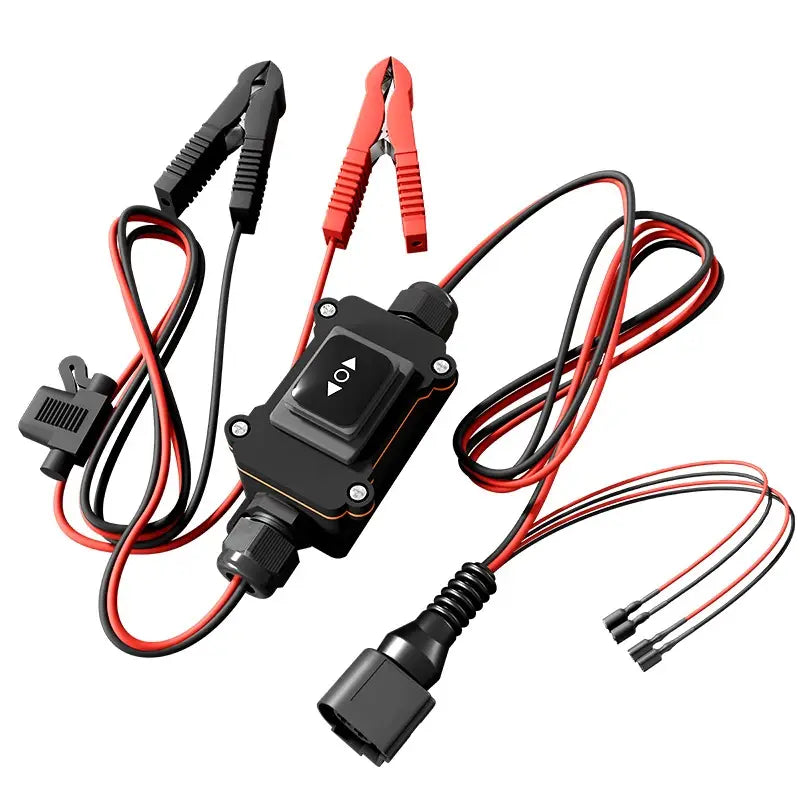 Werkzeug zum Lösen des EPB-Bremssattels für den Elektromotor mit schwarzem Kunststoffgehäuse, ausgestattet mit roten und schwarzen Klemmen, Netzschalttaste und mehreren elektrischen Steckverbindern zur Verwendung bei Reparaturen am Fahrzeug
